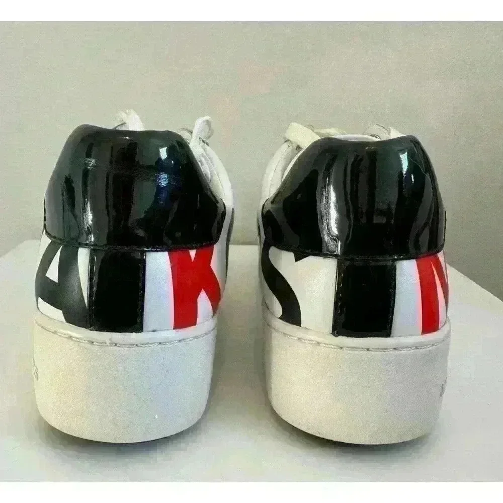 Michael Kors leather sneakers logo wrap around size. 7M  patent leather on back